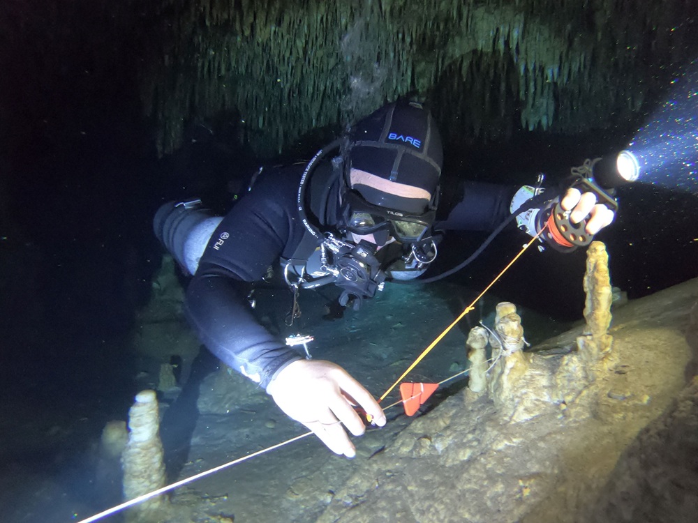 Cave diver making a connection