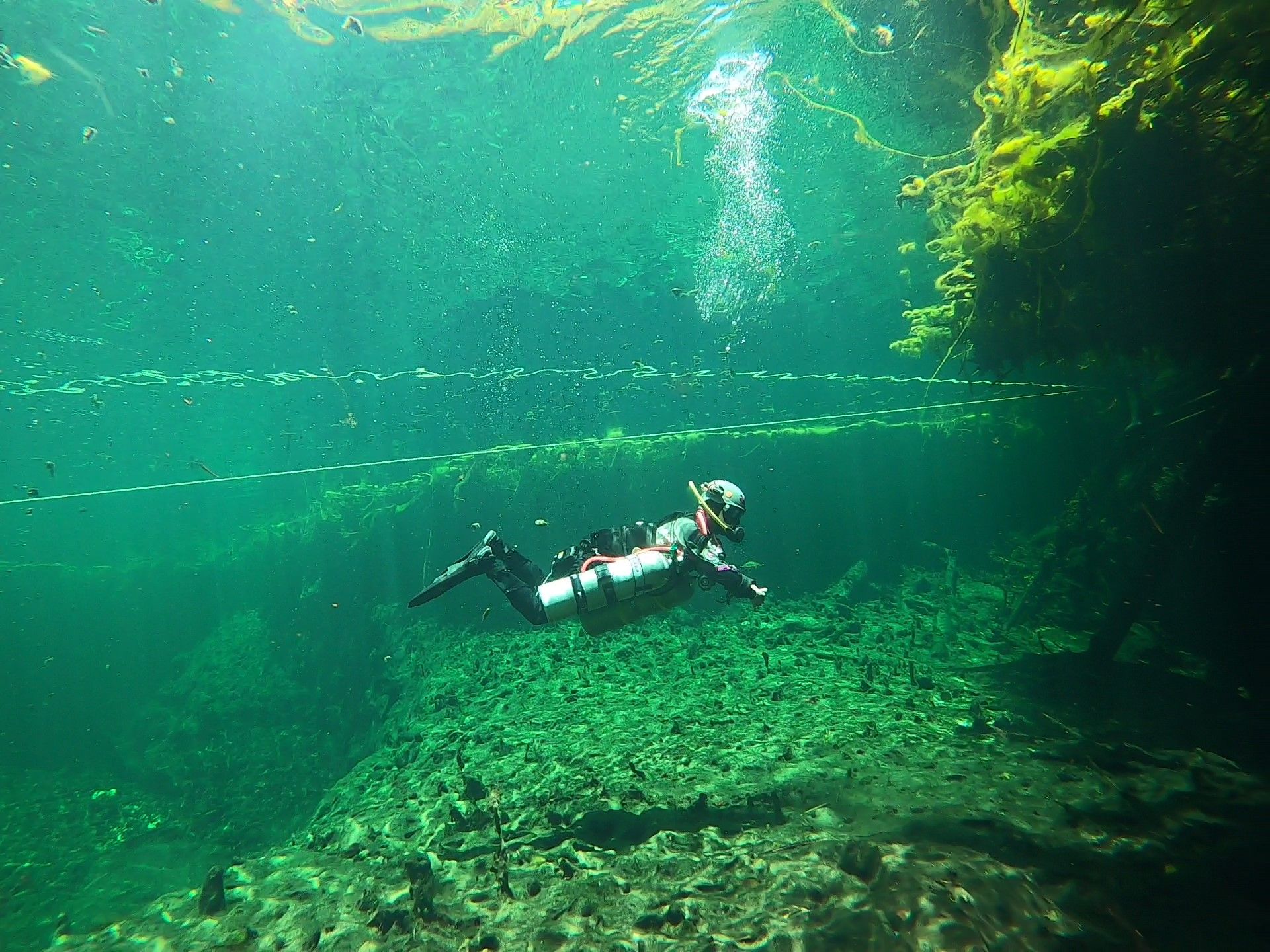 Diver in sidemount configuration entering the overhead environment